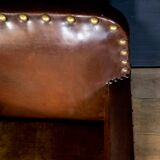 Antique club armchair of leather cloth