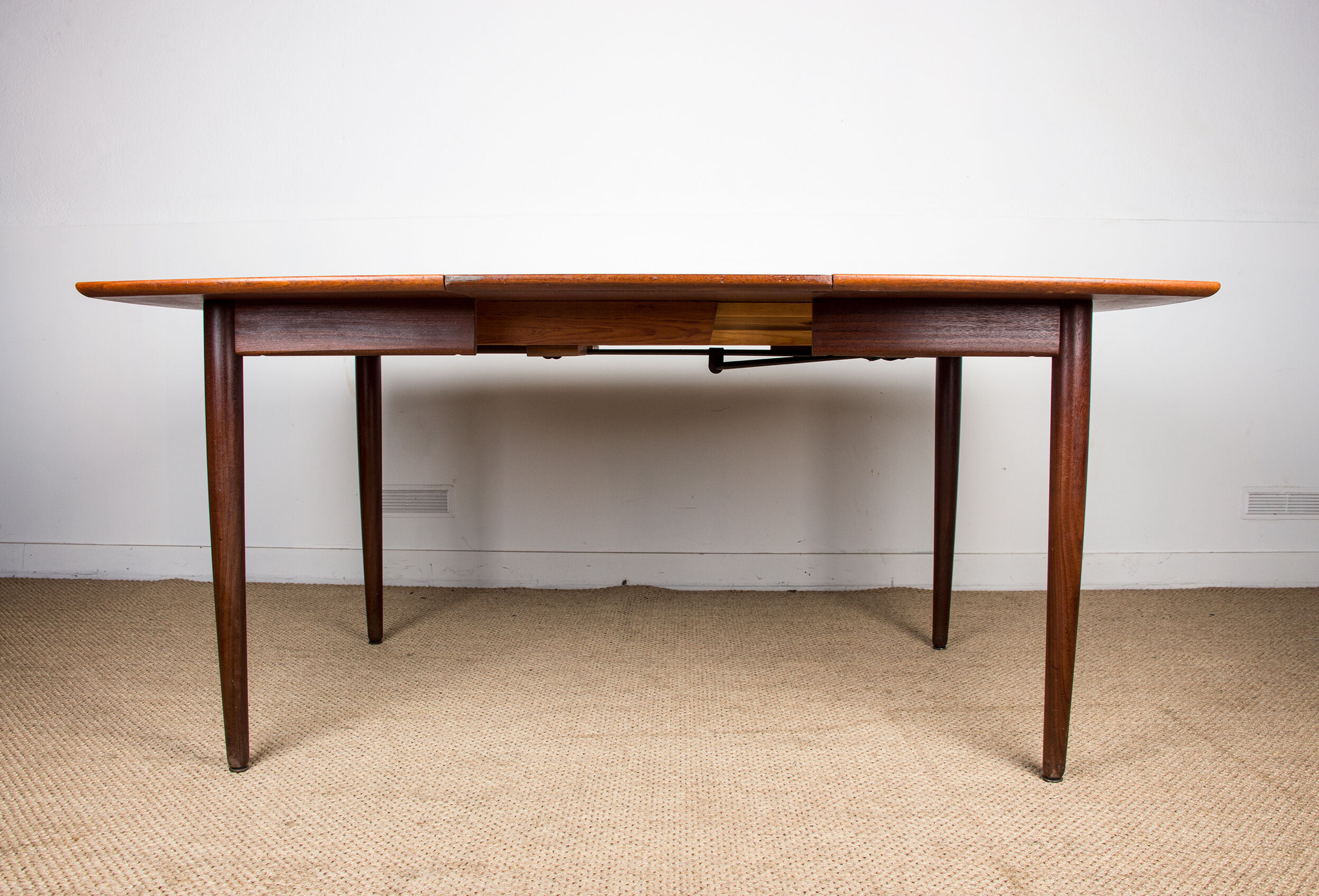 Expandable square teak dining table by Henry Walter Klein 1960