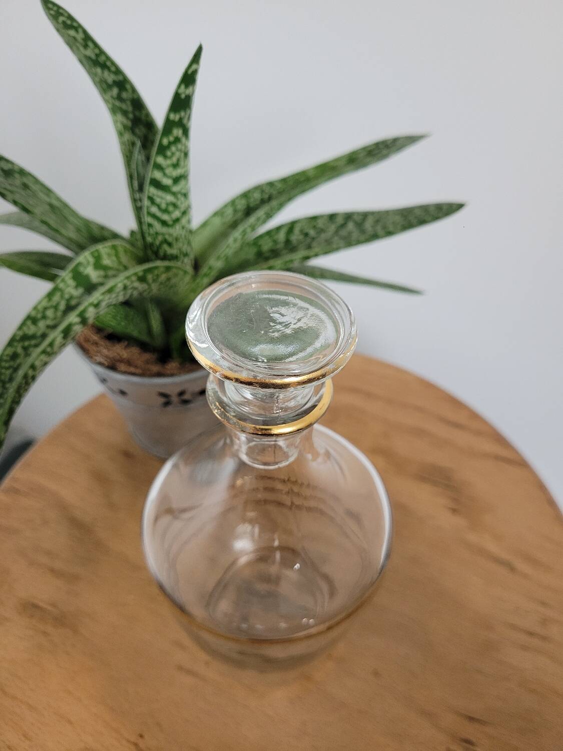 Small glass bottle with gold edges