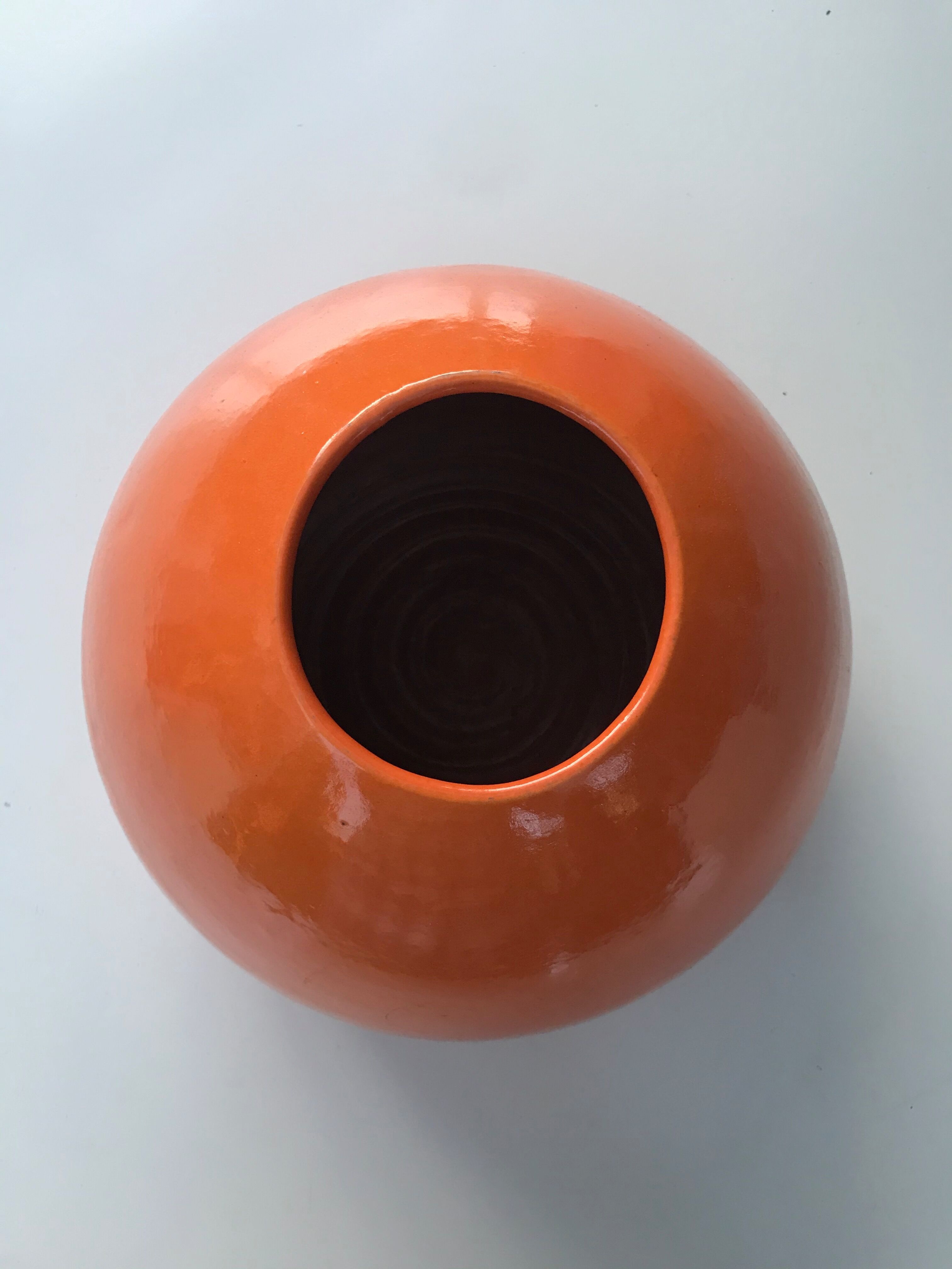 Orange terracotta vase