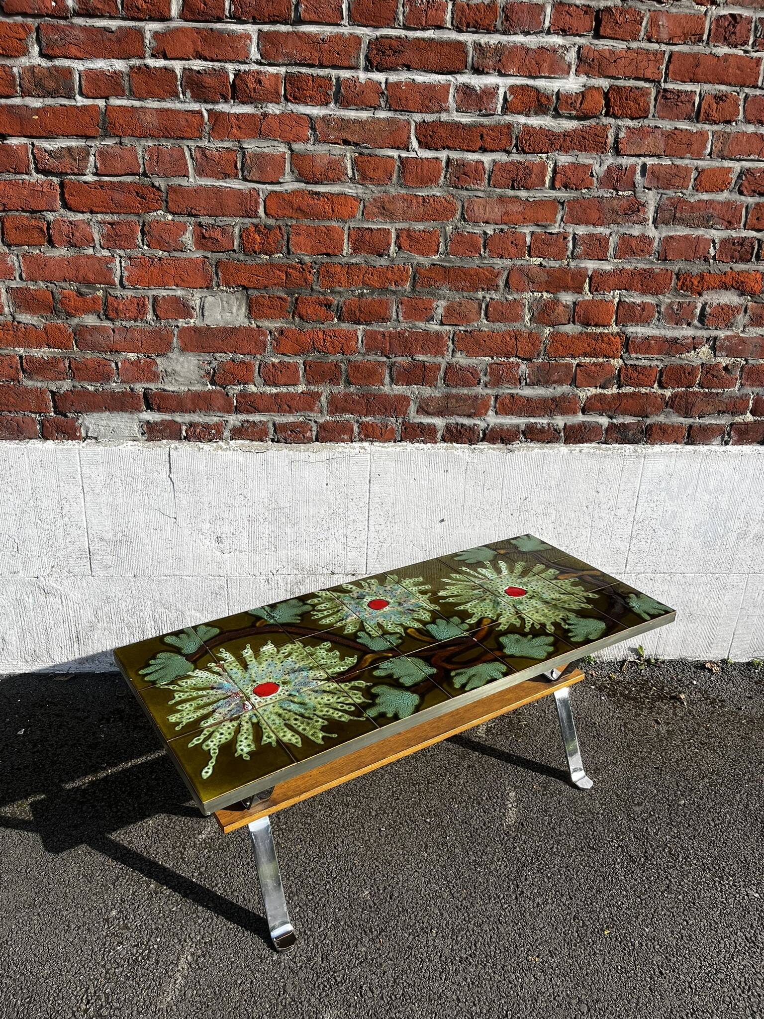 Vintage ceramic coffee table, floral patterns and chrome base.