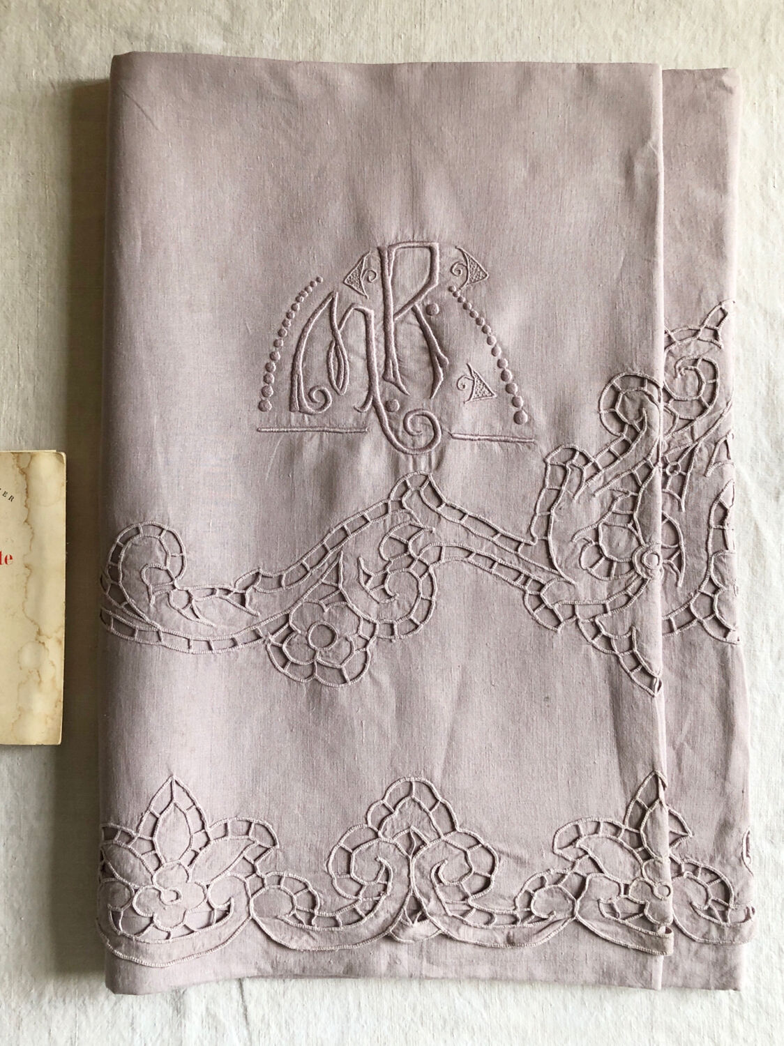 Old embroidered towel tinted purple aurora