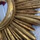 Vintage 1960s sunburst witch's eye mirror in gold - 27 cm