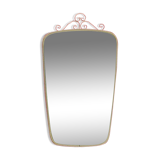 Antique free-form wall mirror with gilt frame and brass ornament
