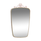 Antique free-form wall mirror with gilt frame and brass ornament
