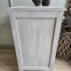 Two solid wood bedside tables with calfskin decoration.