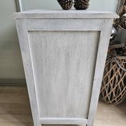Two solid wood bedside tables with calfskin decoration.