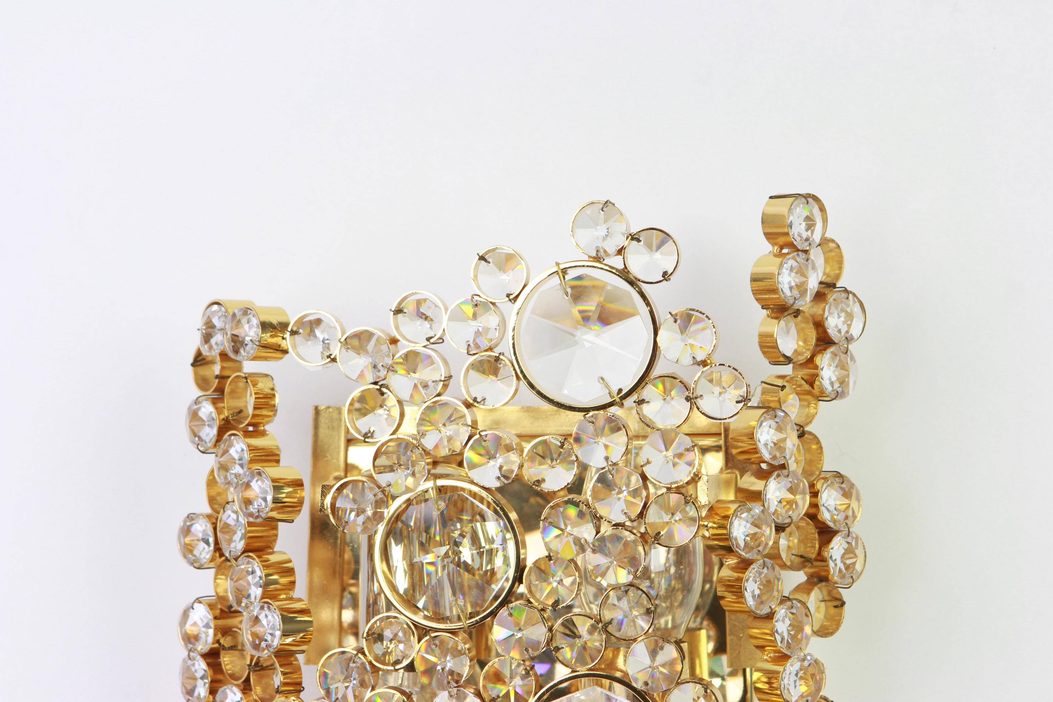 Pair of wall sconces in gilded brass and crystal by Palwa, Germany, 1960s.