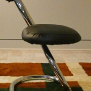 Cobra chairs in steel and black leather by Giotto Stoppino, 1970s, set of 5.