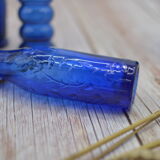 Set of 4 blue bottles of decoration