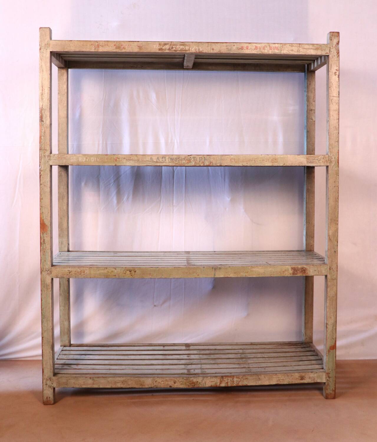 Teak bookshelf with original off-white patina.