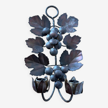 Candle holder with vine leaves and bunches of grapes in wrought iron