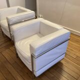Pair of white leather and chrome armchairs