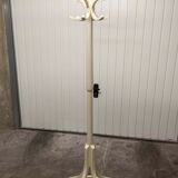 Parrot wears white Baumann coat 1970