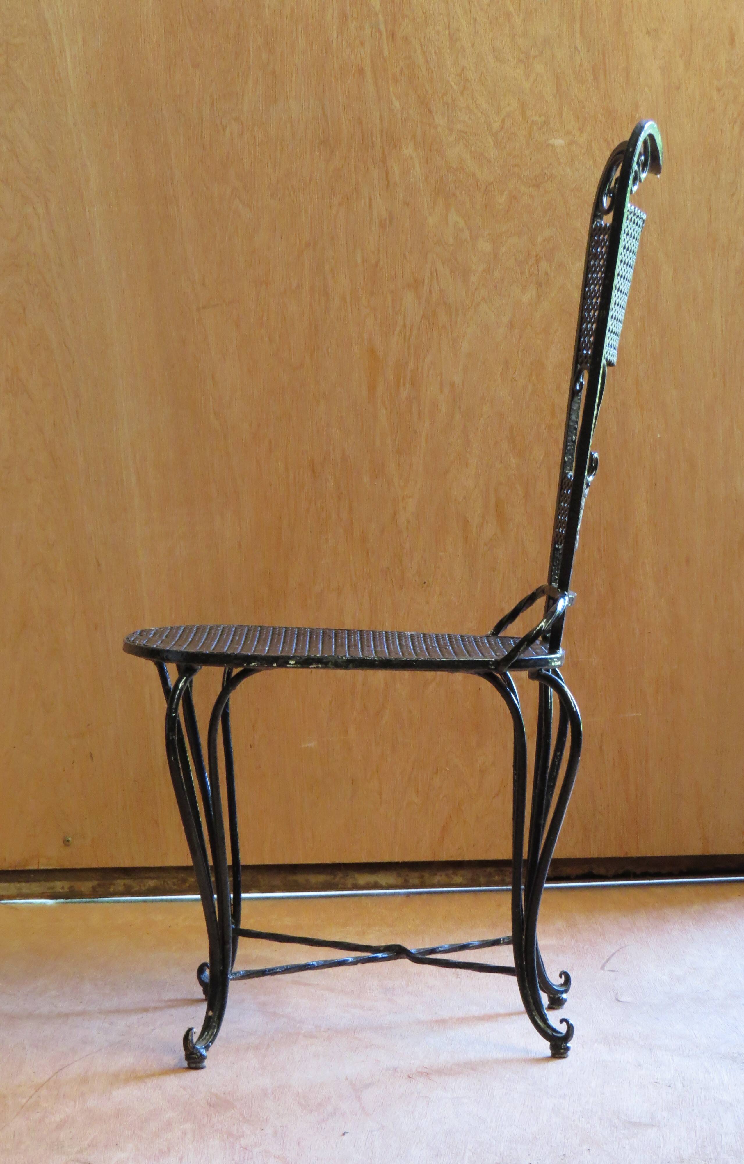 Pair of black lacquered wrought iron garden chairs