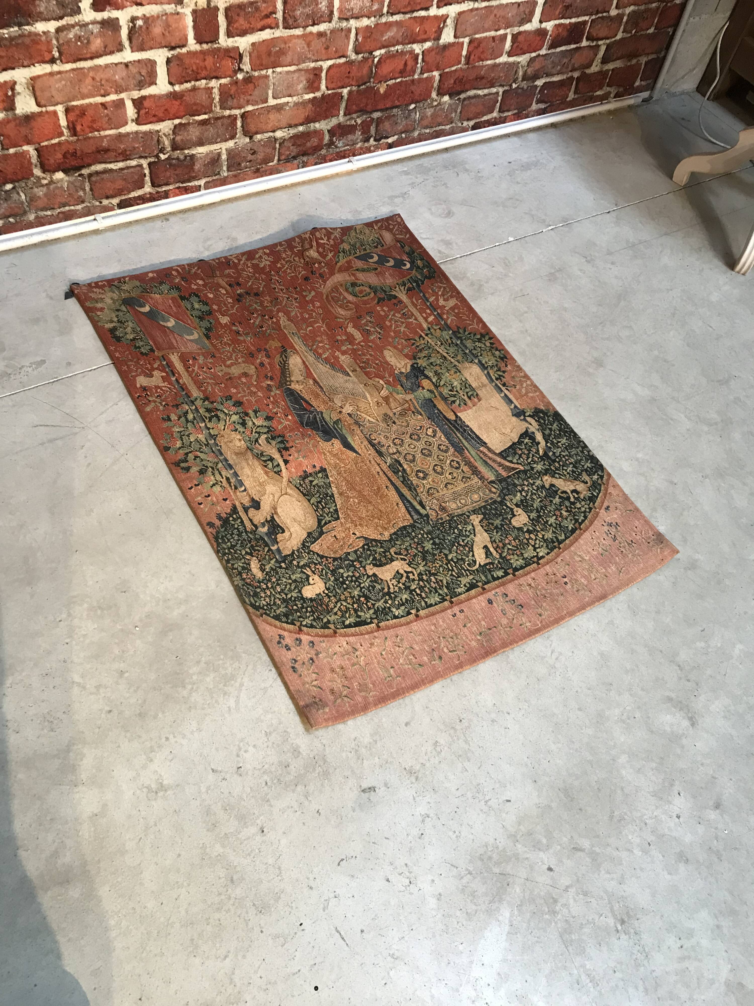 Tapestry reproduction of the lady with the unicorn