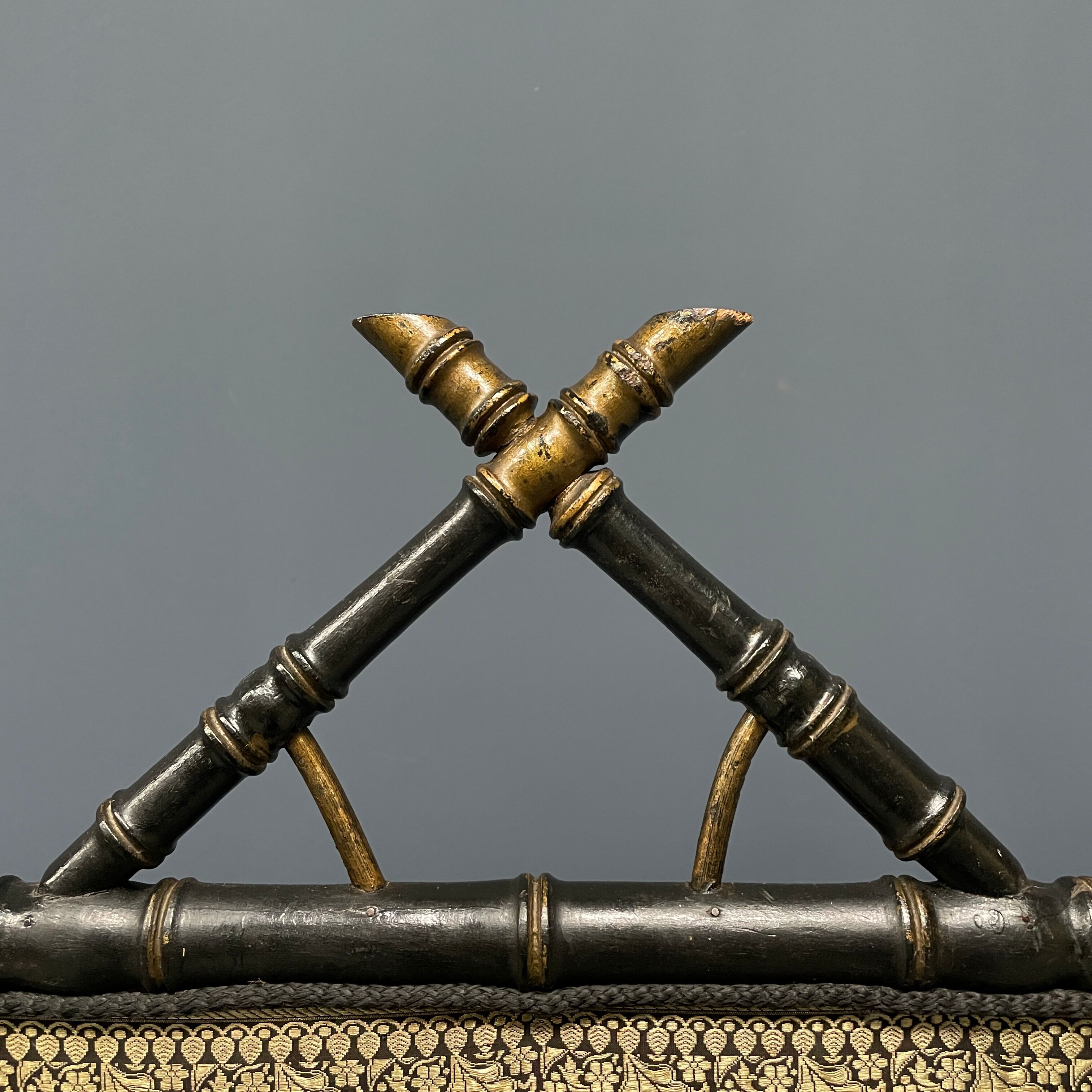 Antique black and gold faux bamboo fireplace screen