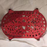 Vintage oval dark coral pink cast iron trivet