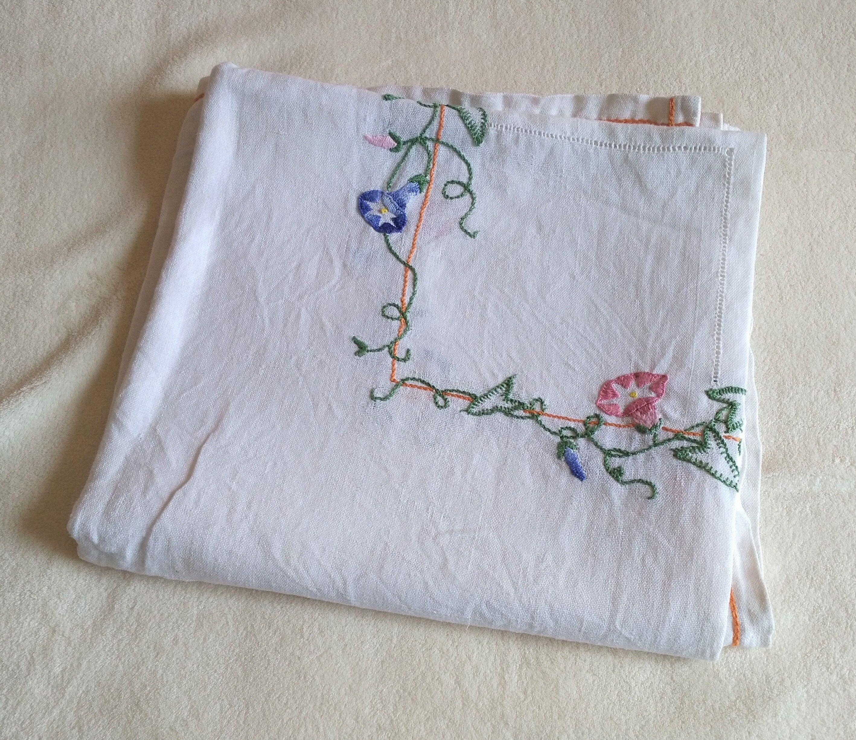 Antique linen tablecloth embroidered with flowers