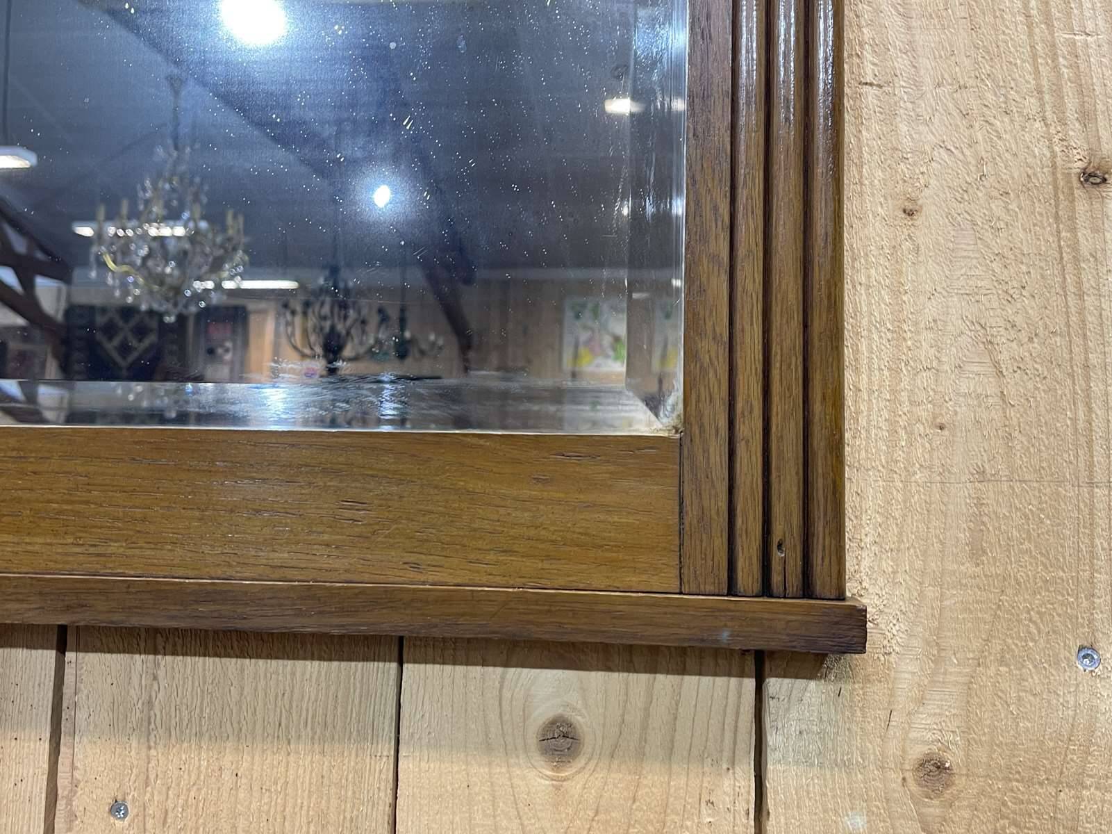 Art deco period beveled mirror in oak