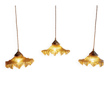 Set of three fluted amber glass pendants, 1930s.