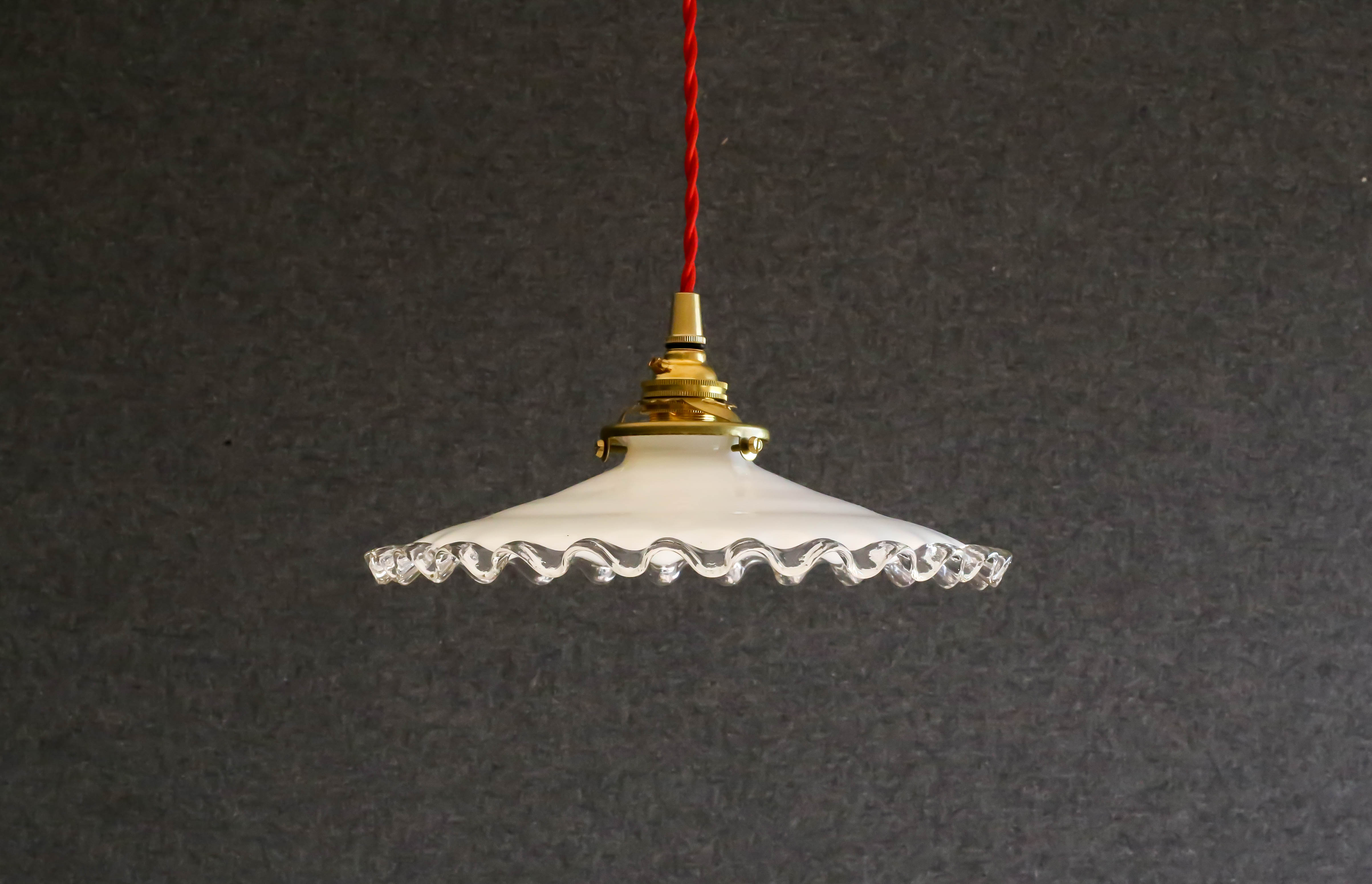 White opaline pendant light with crenellated edges