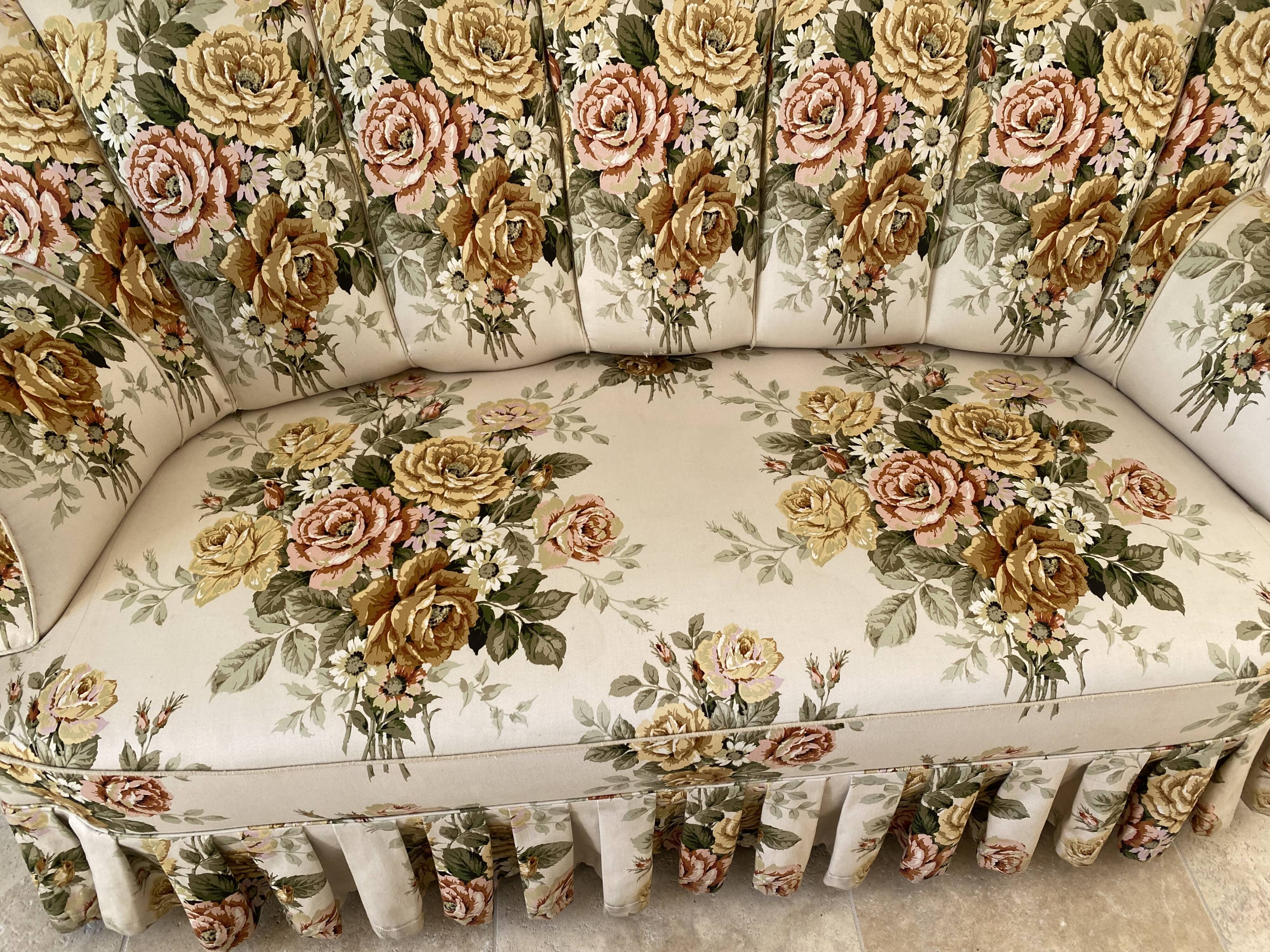 Napoleon III floral toad sofa with boudoir spirit and sliced backrest.