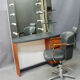 Spotlight hairdresser and her vintage barber chair