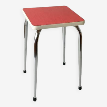 Stool in pinkish red formica