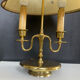 Directoire style bouillotte lamp in brass with double lights.