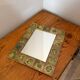 Vintage 1960s green and brown glazed ceramic mirror.