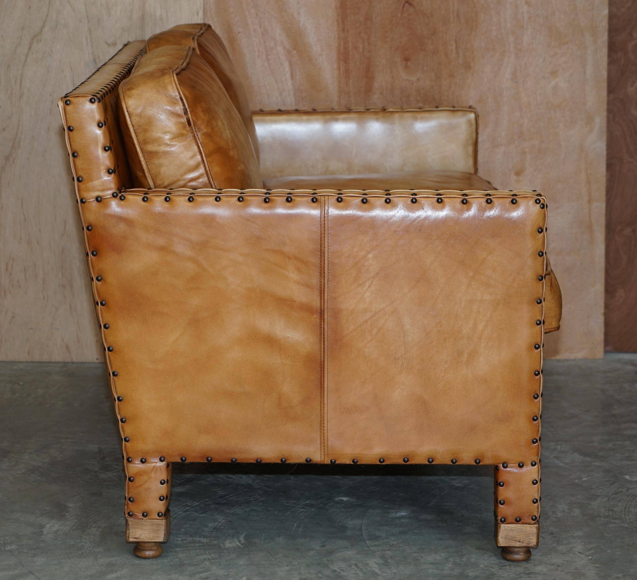 Two-seater leather canapé, hand-tanned, Edwardian style with studs.