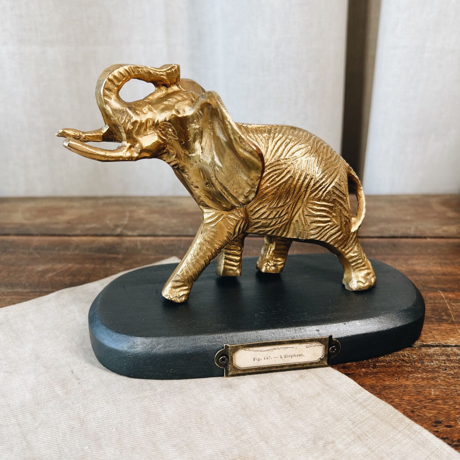 Bronze elephant on pedestal