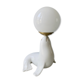Ceramic and opaline sea lion lamp