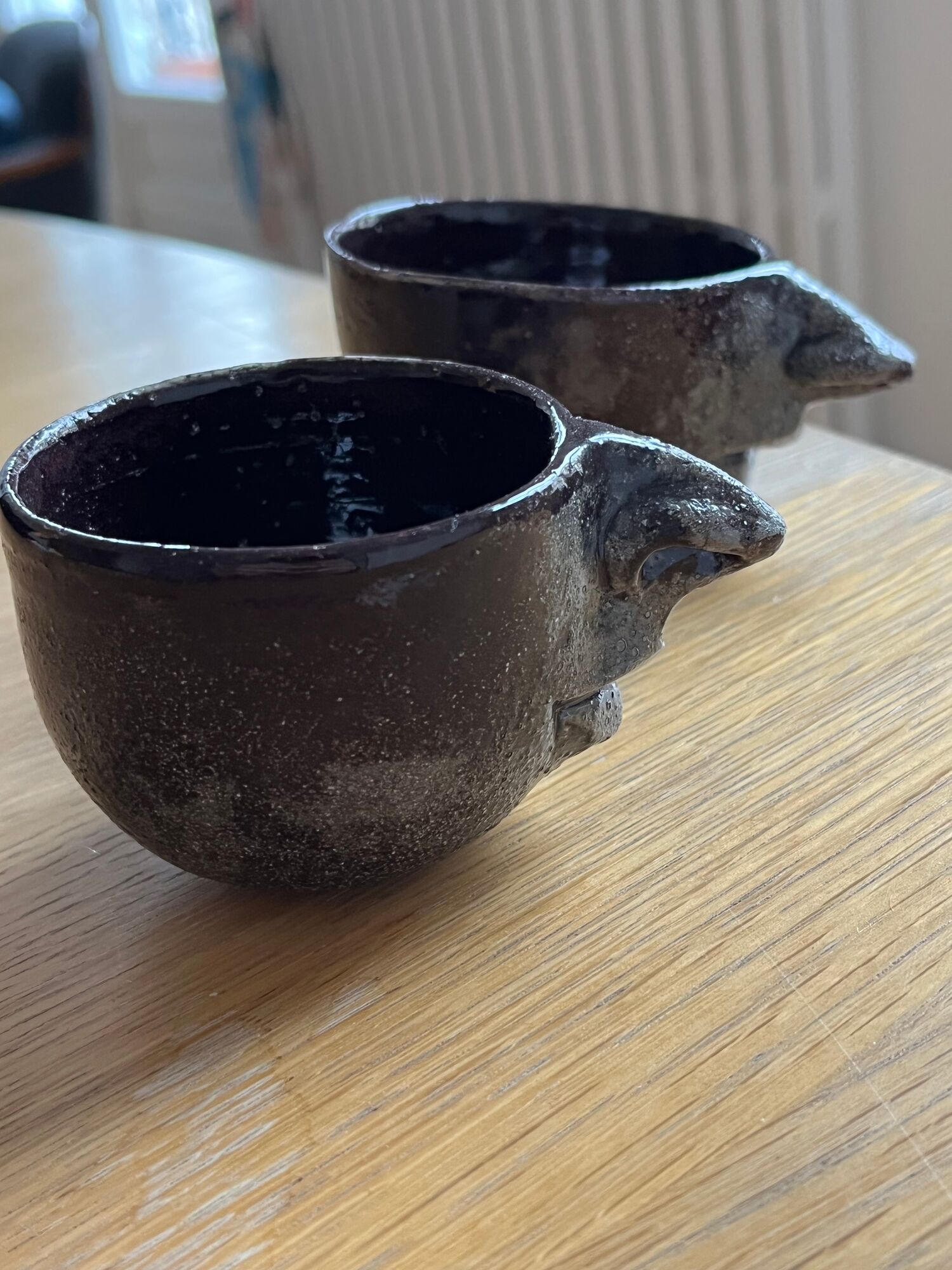 Ceramic coffee cups human nose and mouth