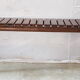 Bench with slats and feet of charpoy beds in teak