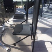 Set of 6 dining room chairs with tripod legs in grained leather and metal 1970