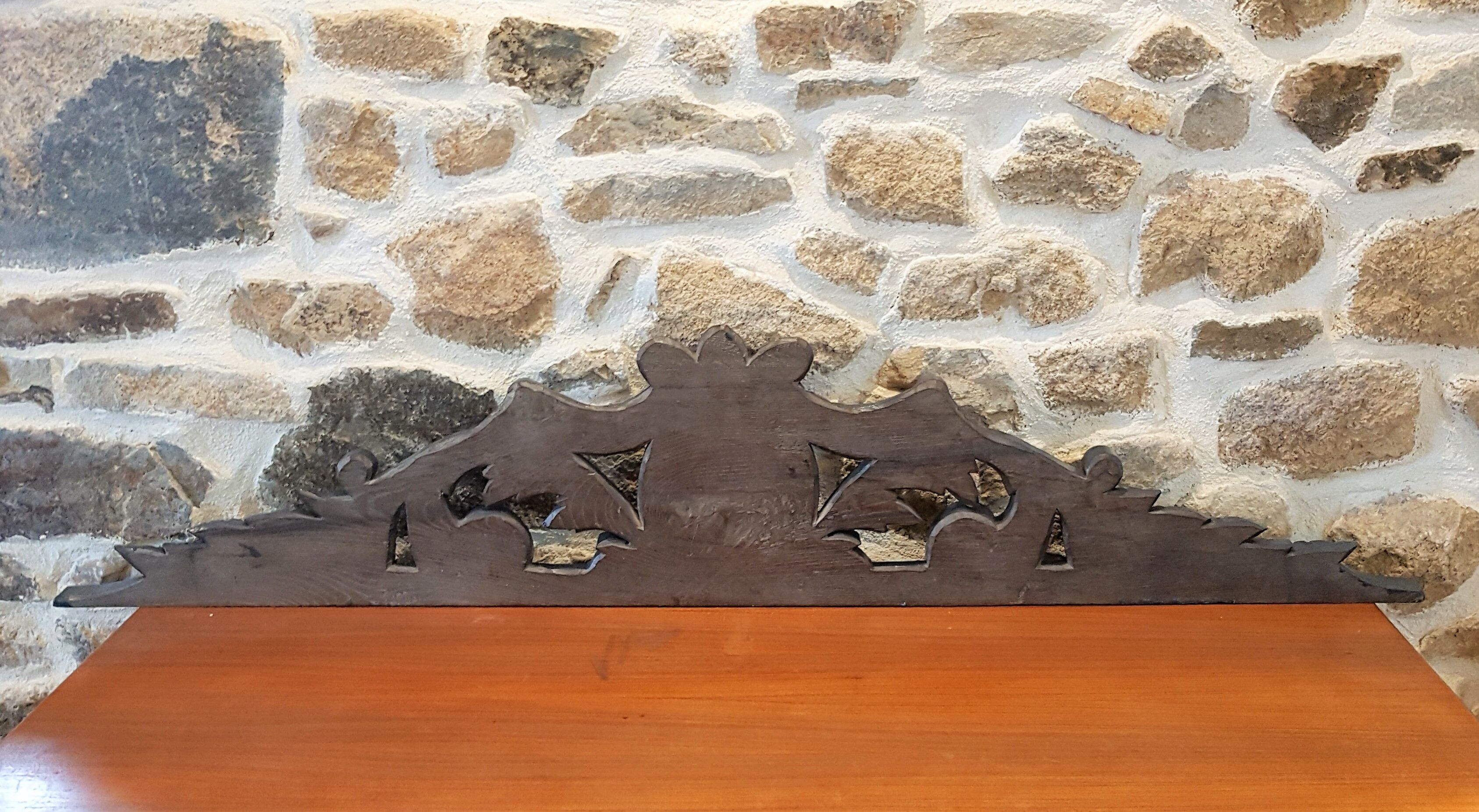 Old carved wooden pediment