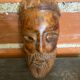 Moroccan mask in carved wood vintage decoration