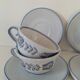 Glazed earthenware cups and saucers