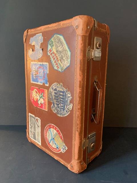 Old travel suitcase and legendary stickers, 1920