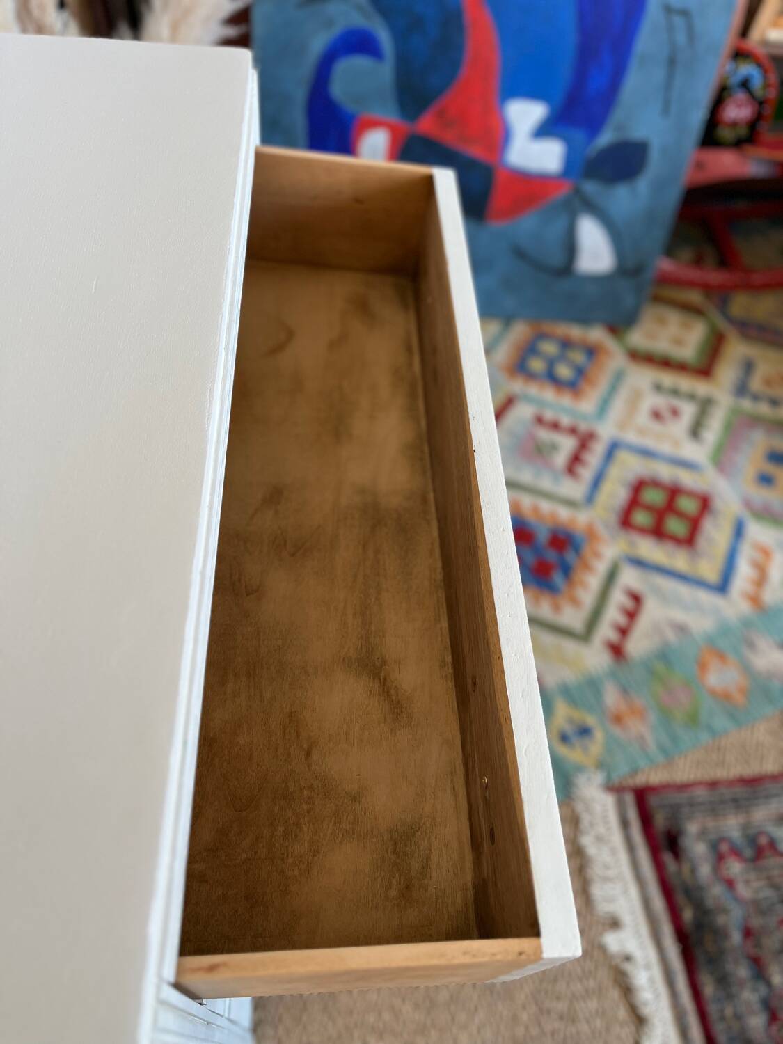 Restored wooden art deco chest of drawers with gilded handles
