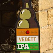 Former advertising wall support for belgian beers vedett ipa - painted wood