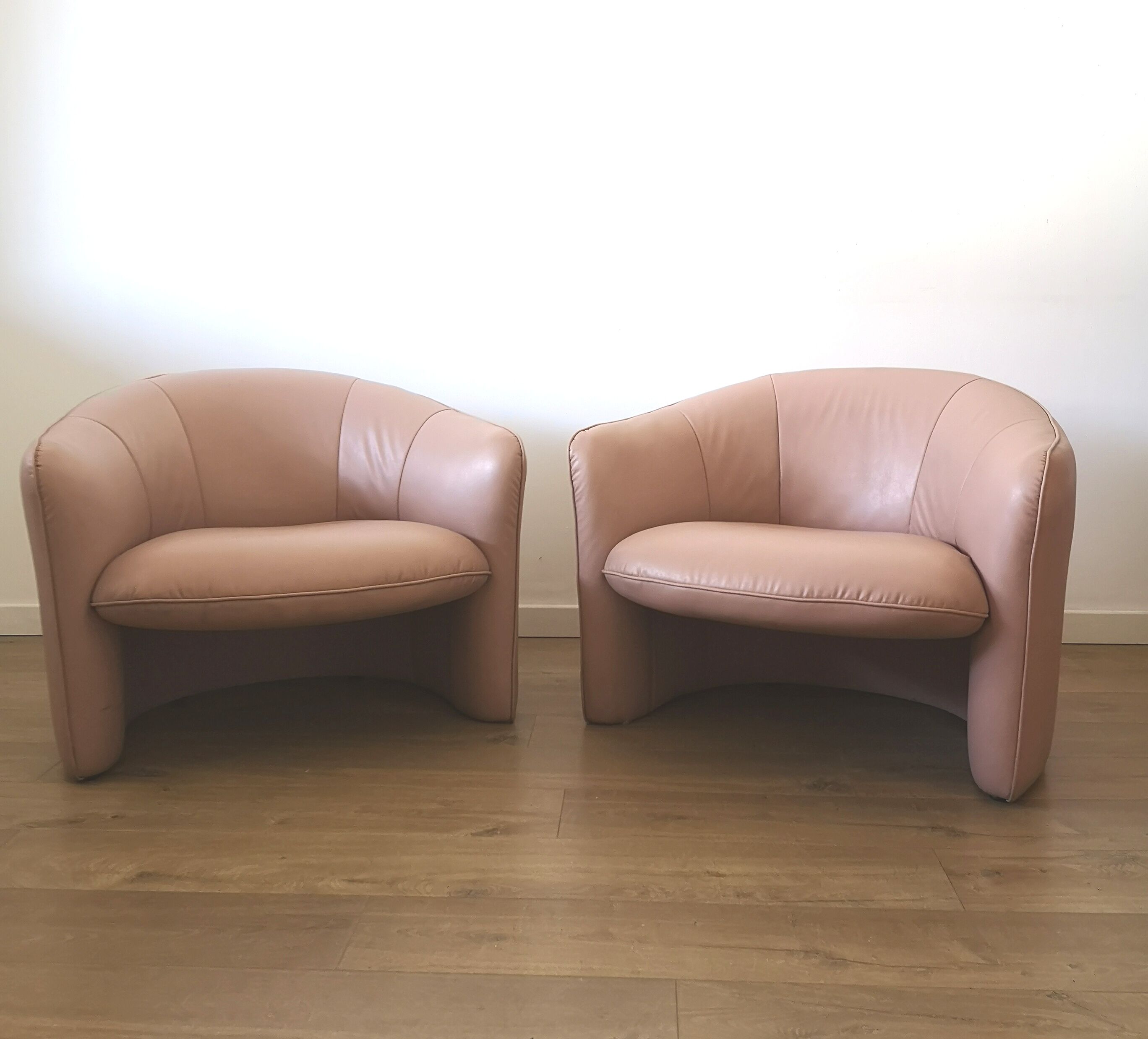 Pair of pink skai armchairs