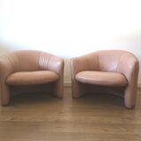 Pair of pink skai armchairs