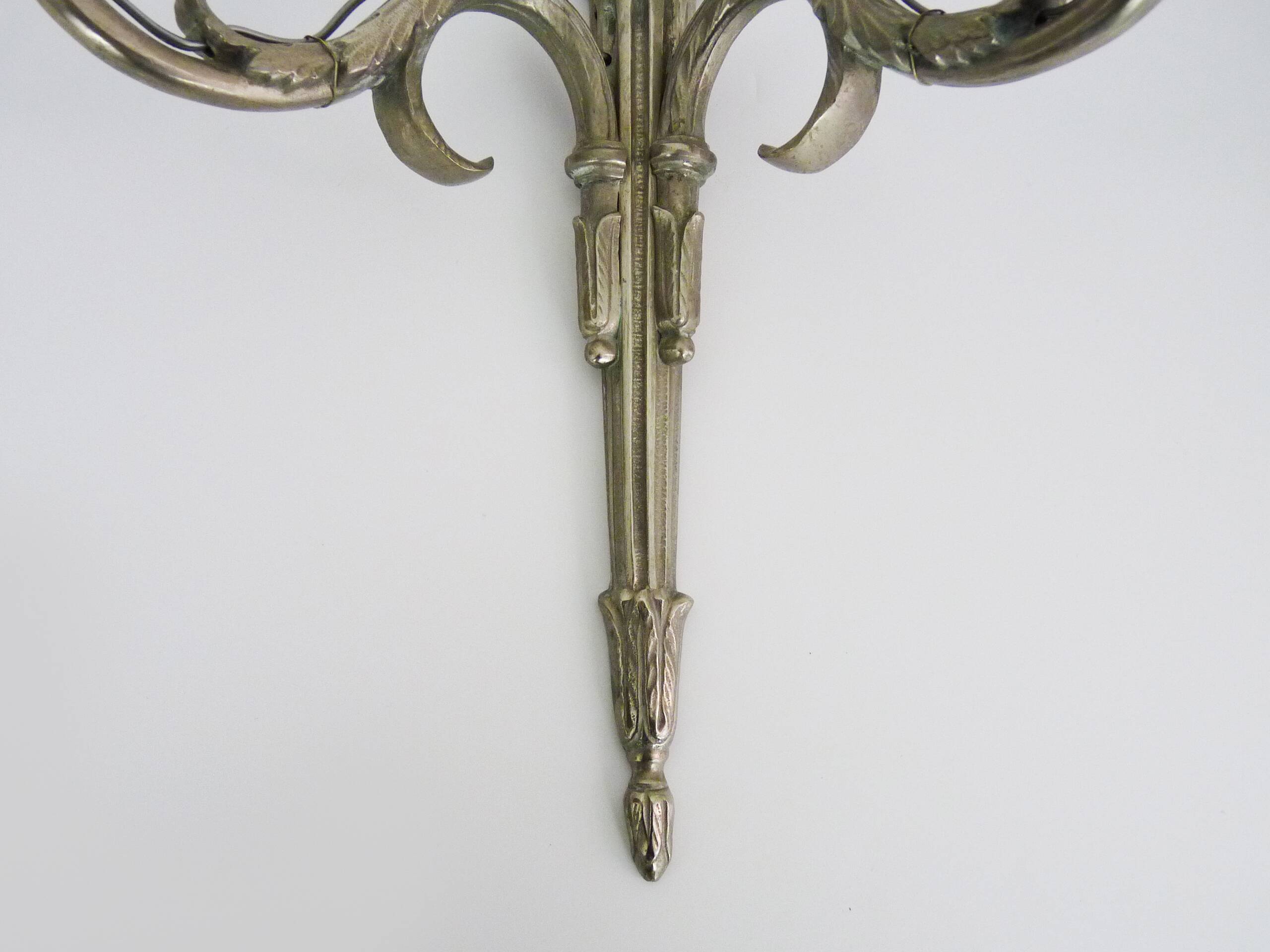Pair of empire style double light wall lights in silvered bronze. the 50's