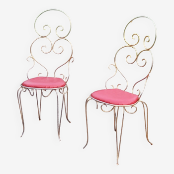 Pair of chairs from the 50s in gilded metal seated red skaï