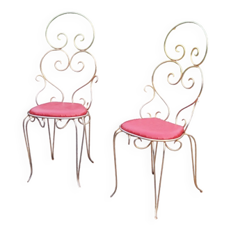 Pair of chairs from the 50s in gilded metal seated red skaï