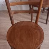 Set of 4 Baumann bistro chairs with round seats.