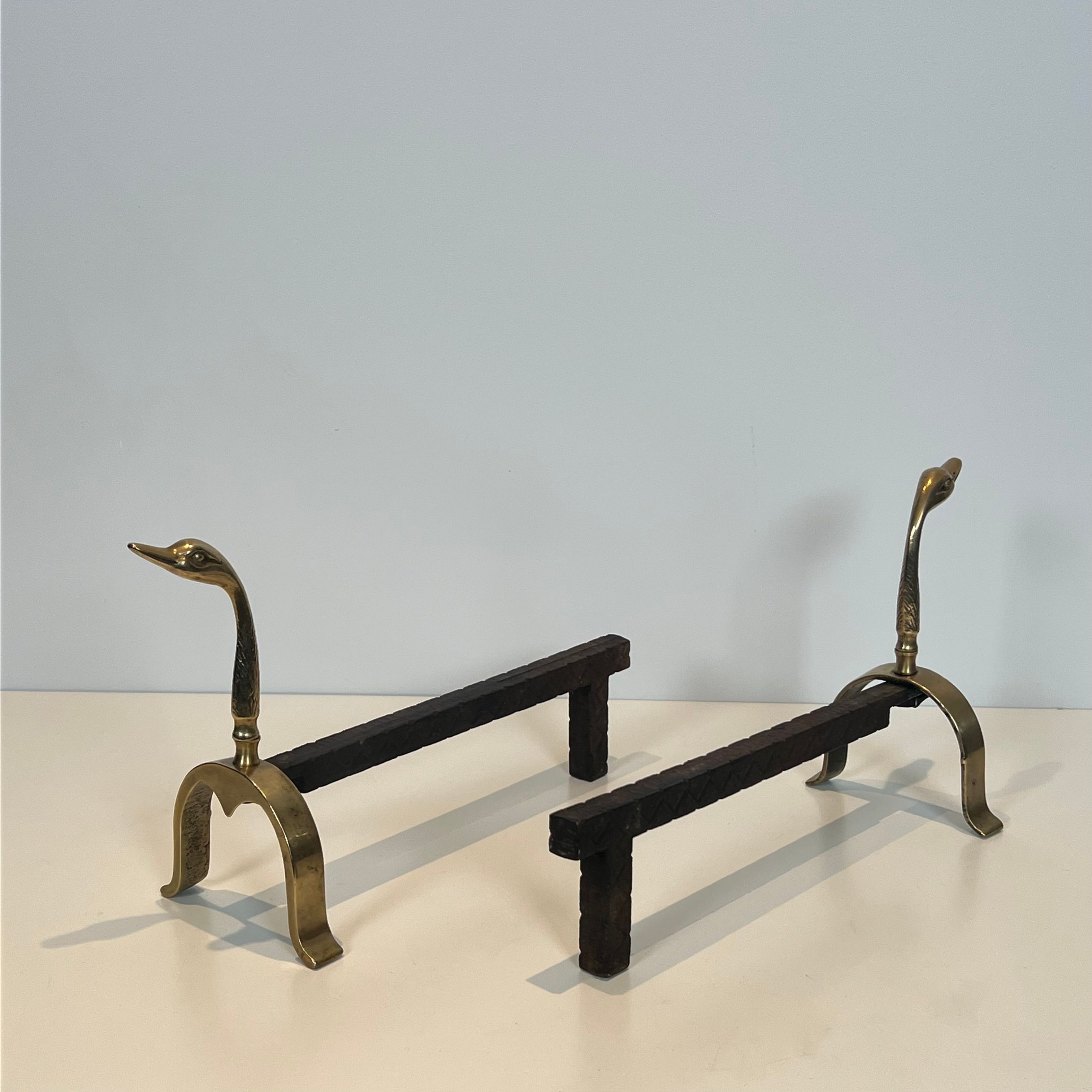 Pair of brass andirons with ducks. In the style of Maison Jansen.